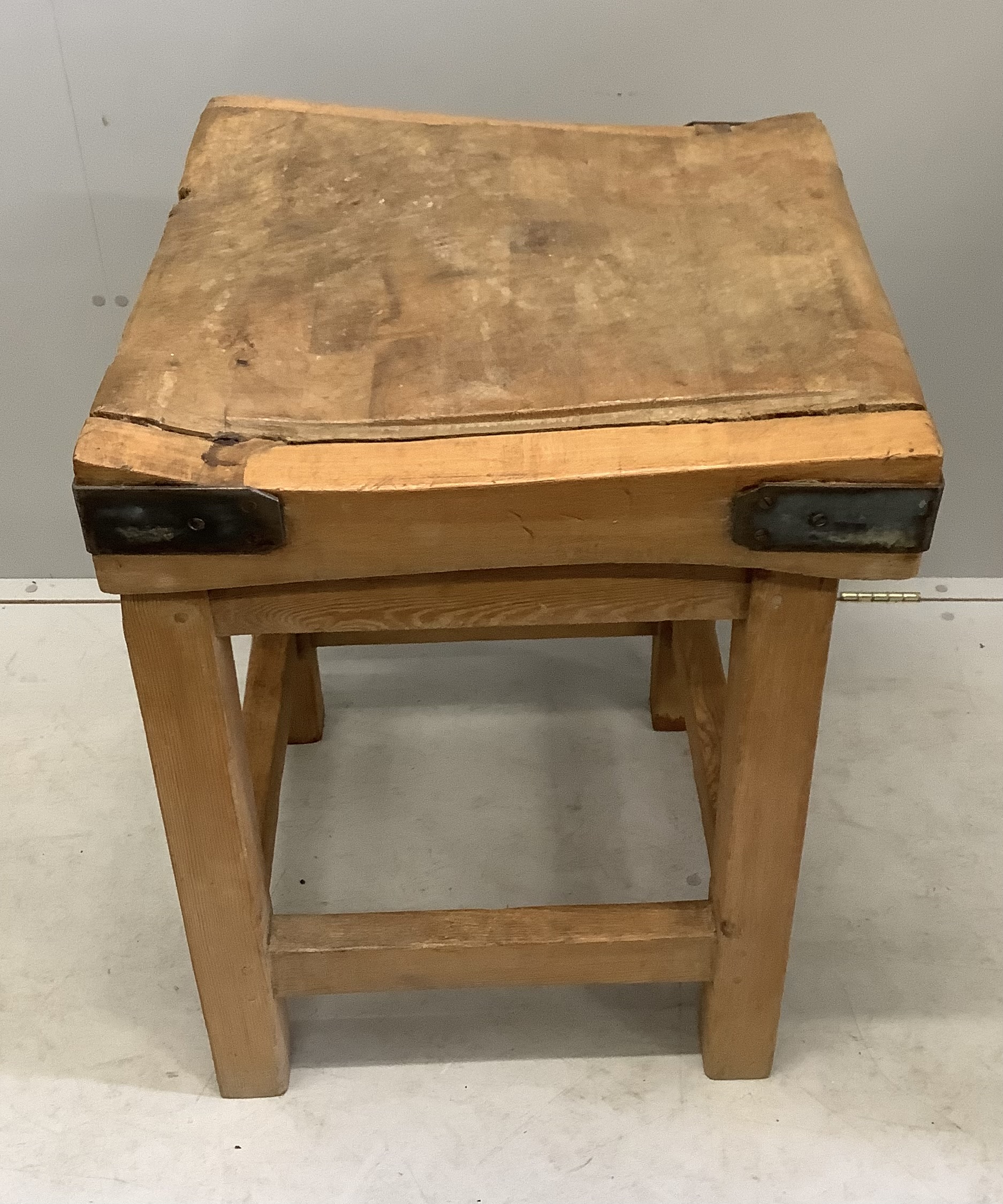 A Victorian iron bound butcher's block on pine stand, width 60cm, depth 61cm, height 81cm